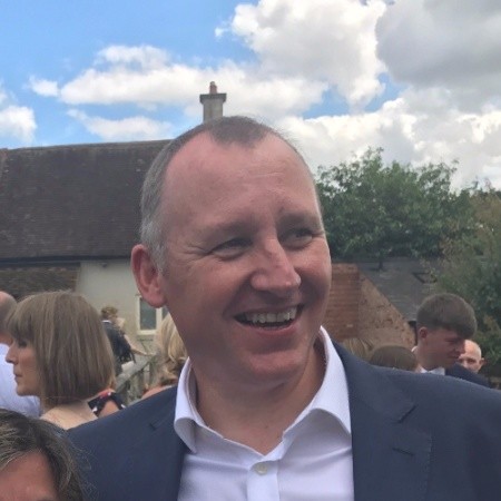 Clive Pearson of Rapier Marketing smiling and wearing a suit without a tie